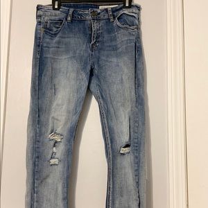 Distressed Light fade jeans with zipper detail